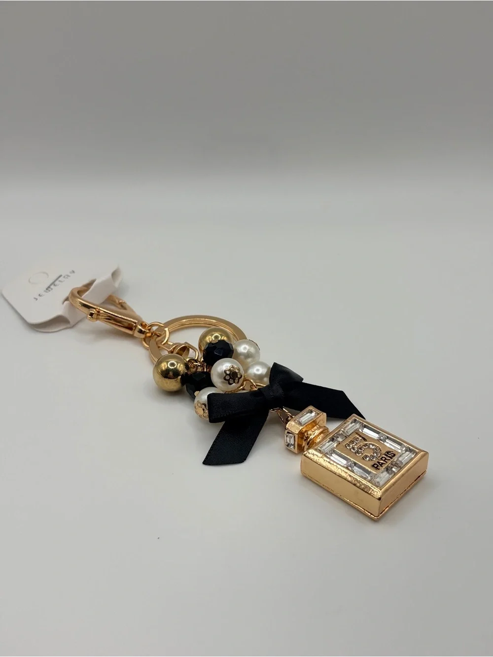 Gold Perfume Bottle Keychain with Black Bow and Pearls